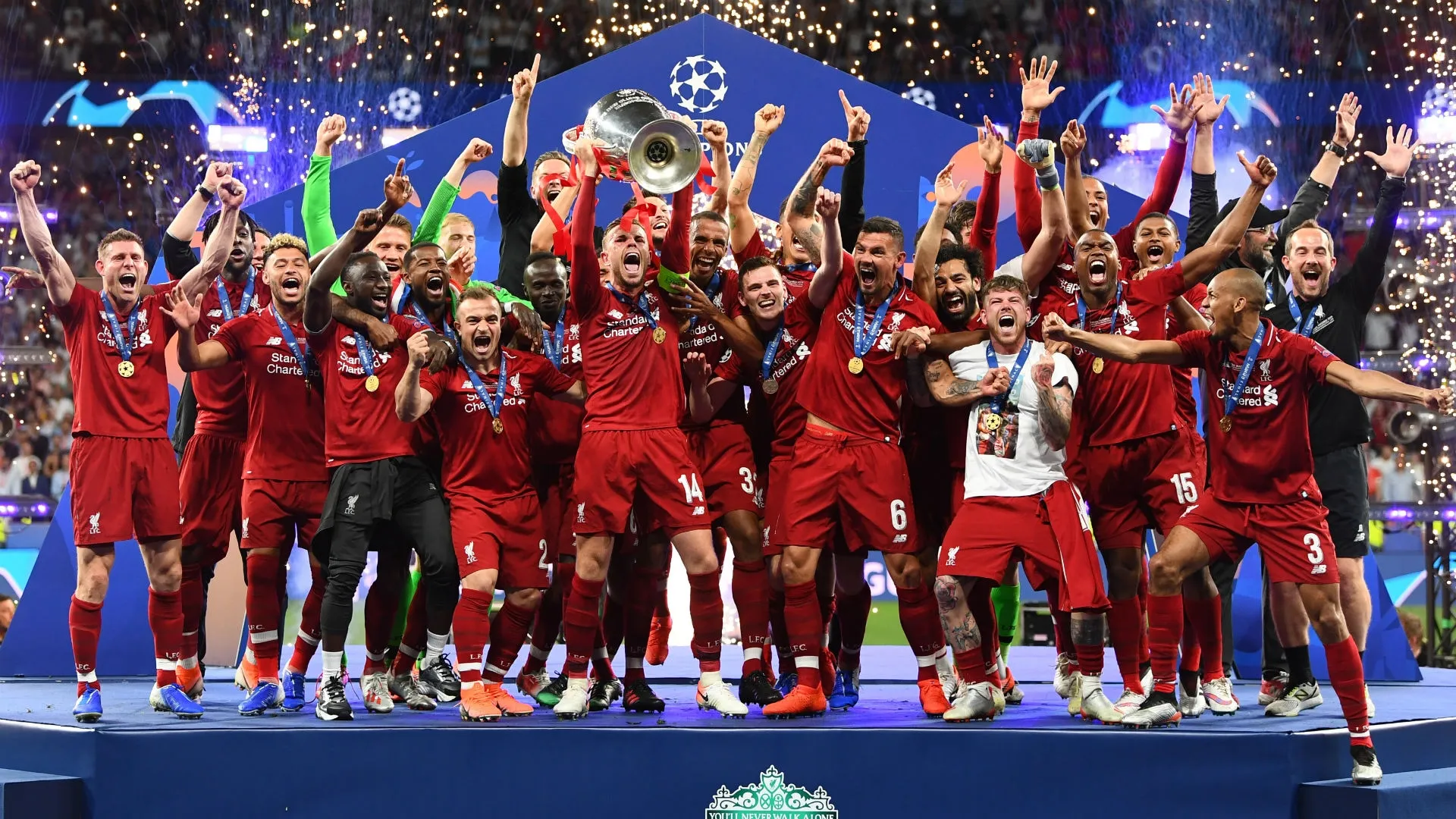 0_FOF2CrOvzDNuF5MU A picture of the Liverpool FC squad lifting the European Cup in 2019.